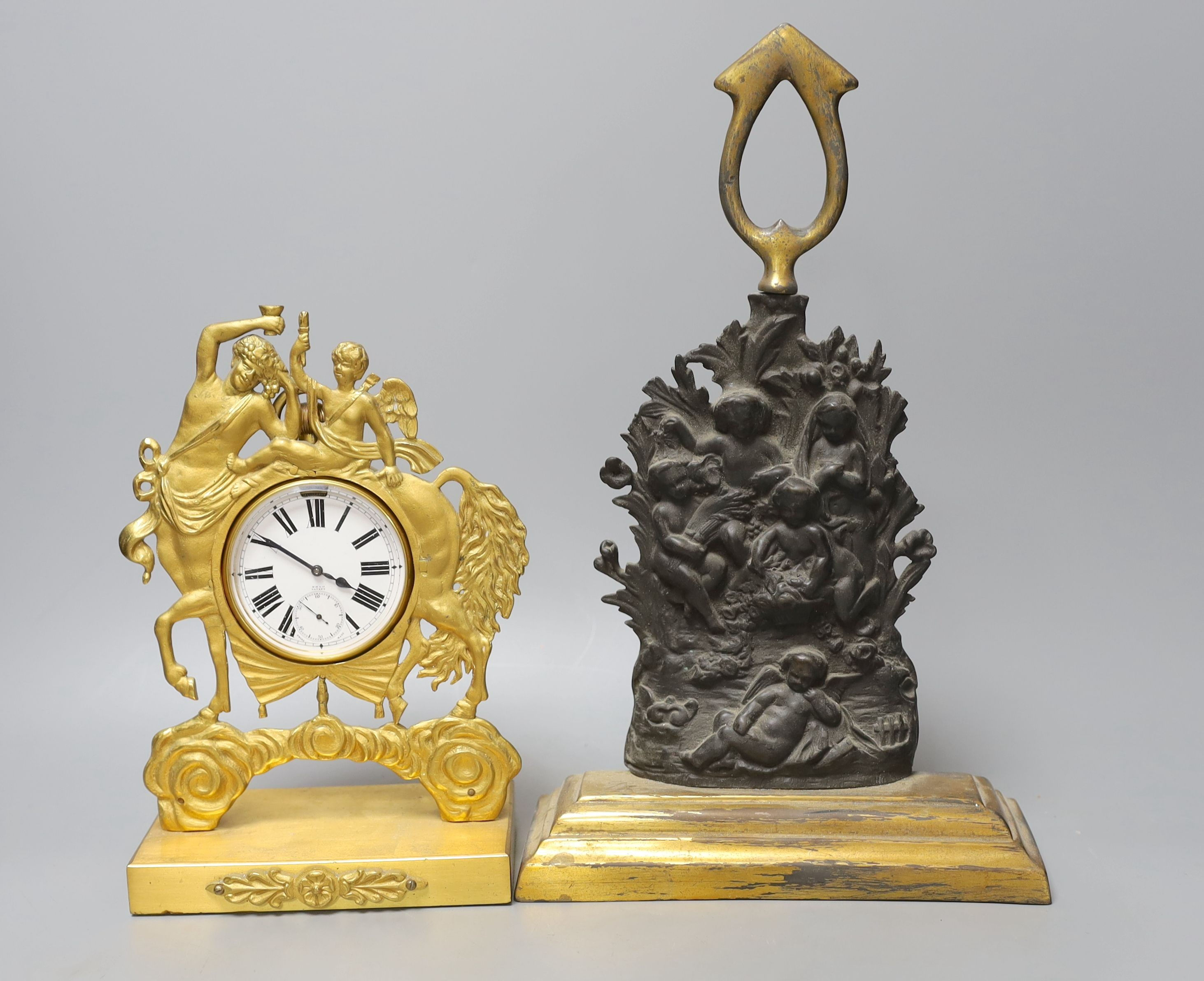 A gilt-metal Goliath pocket watch, in an Empire-style watch-stand, 23cm high, and a lead-weighted bronze door-stop